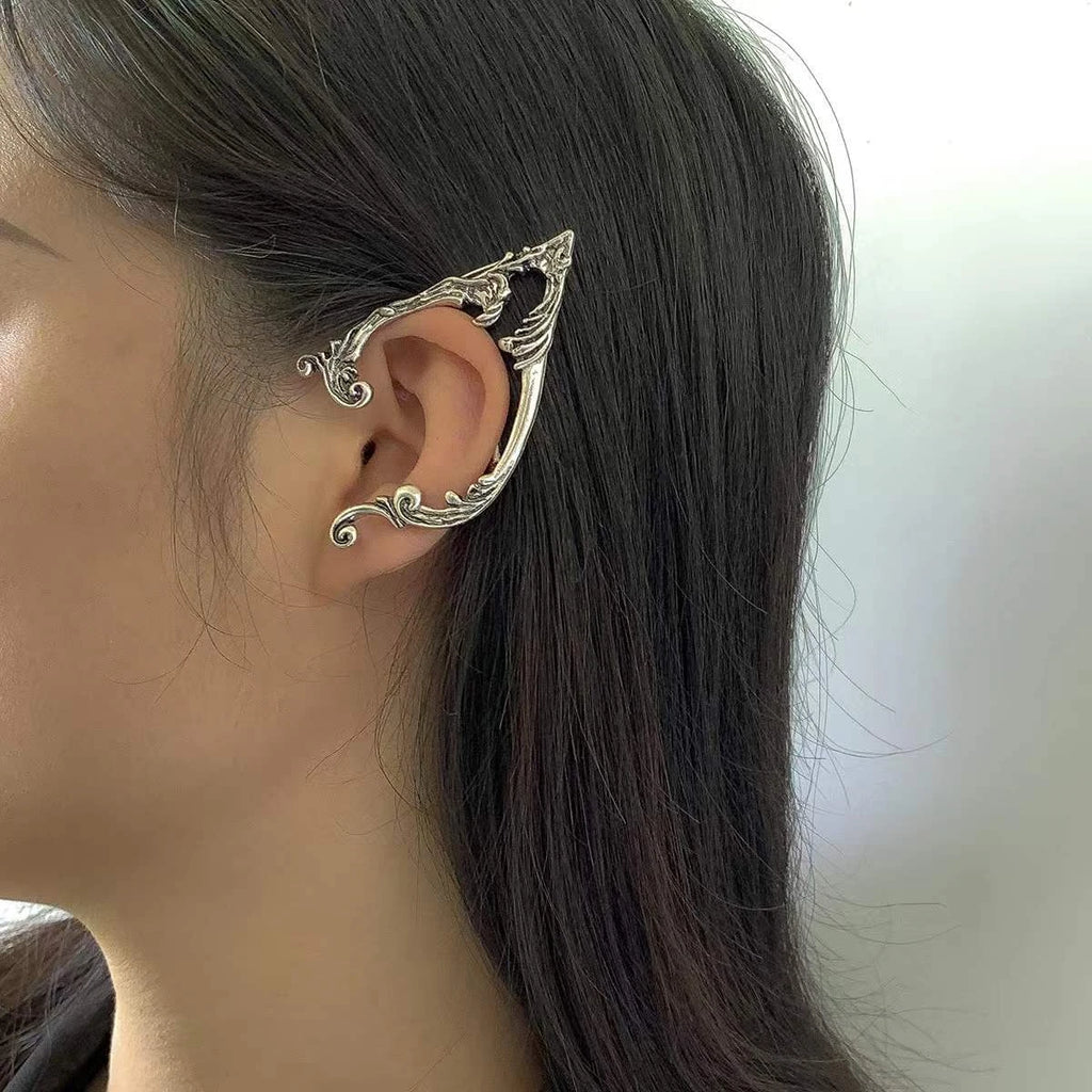 Antique silver-tone elf ear cuff worn on the left ear