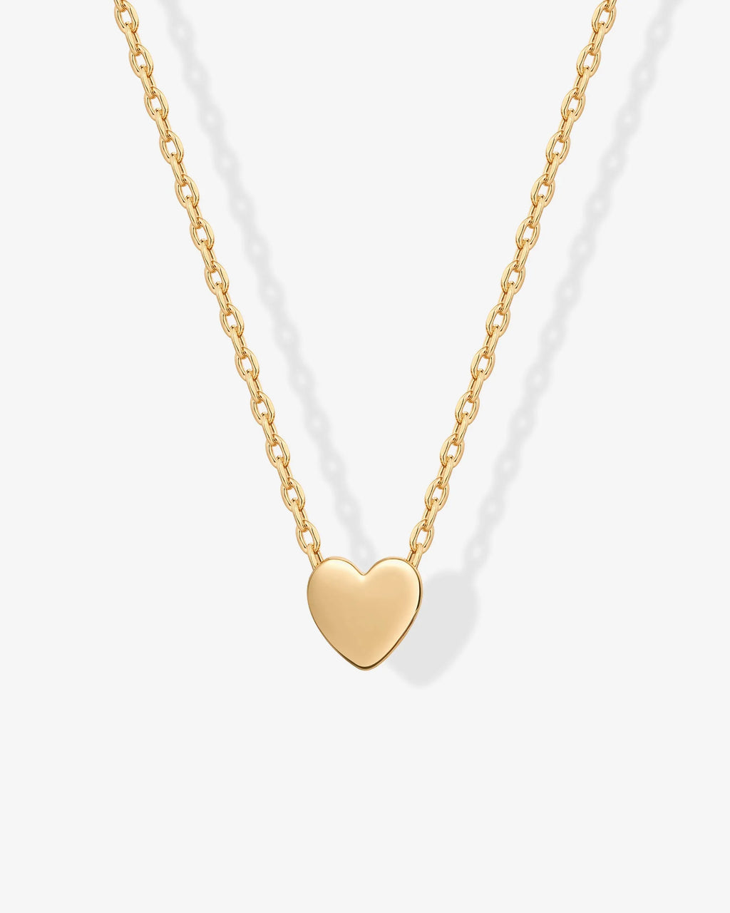 Close-up of a gold-tone heart pendant on a fine chain (PAVOI reference image; supplier appearance awaits verification)
