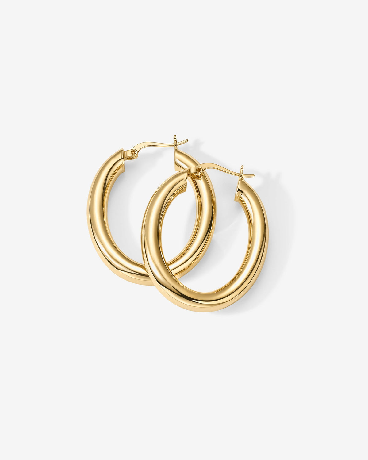 Gold-tone oval hoop earrings arranged with open clasps (PAVOI reference image; supplier appearance awaits verification)