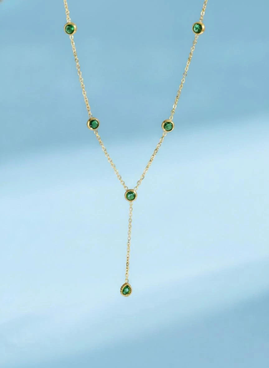 Gold-tone Y-necklace with green round stones and a teardrop pendant
