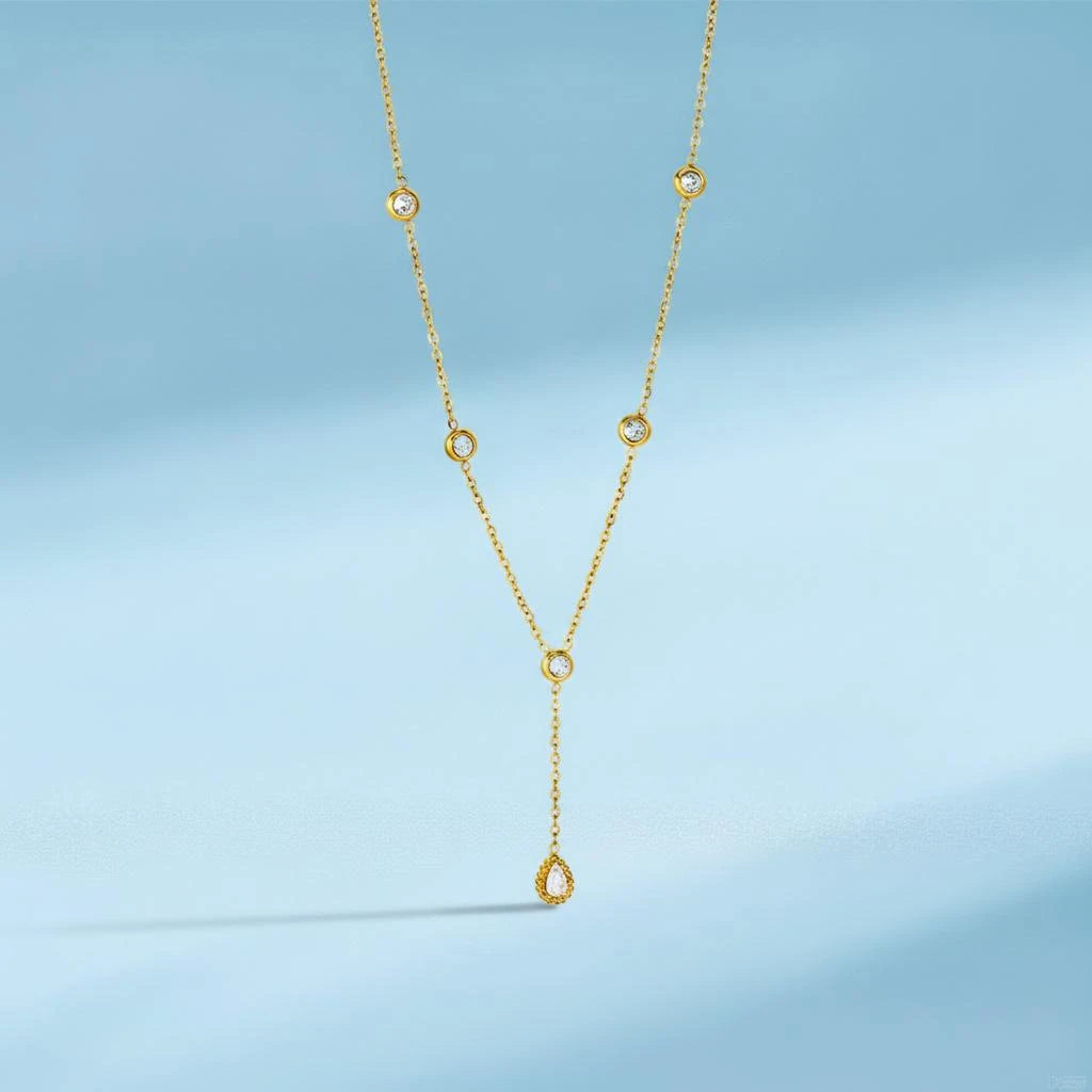 Gold-tone Y-necklace with clear round stones and a teardrop pendant