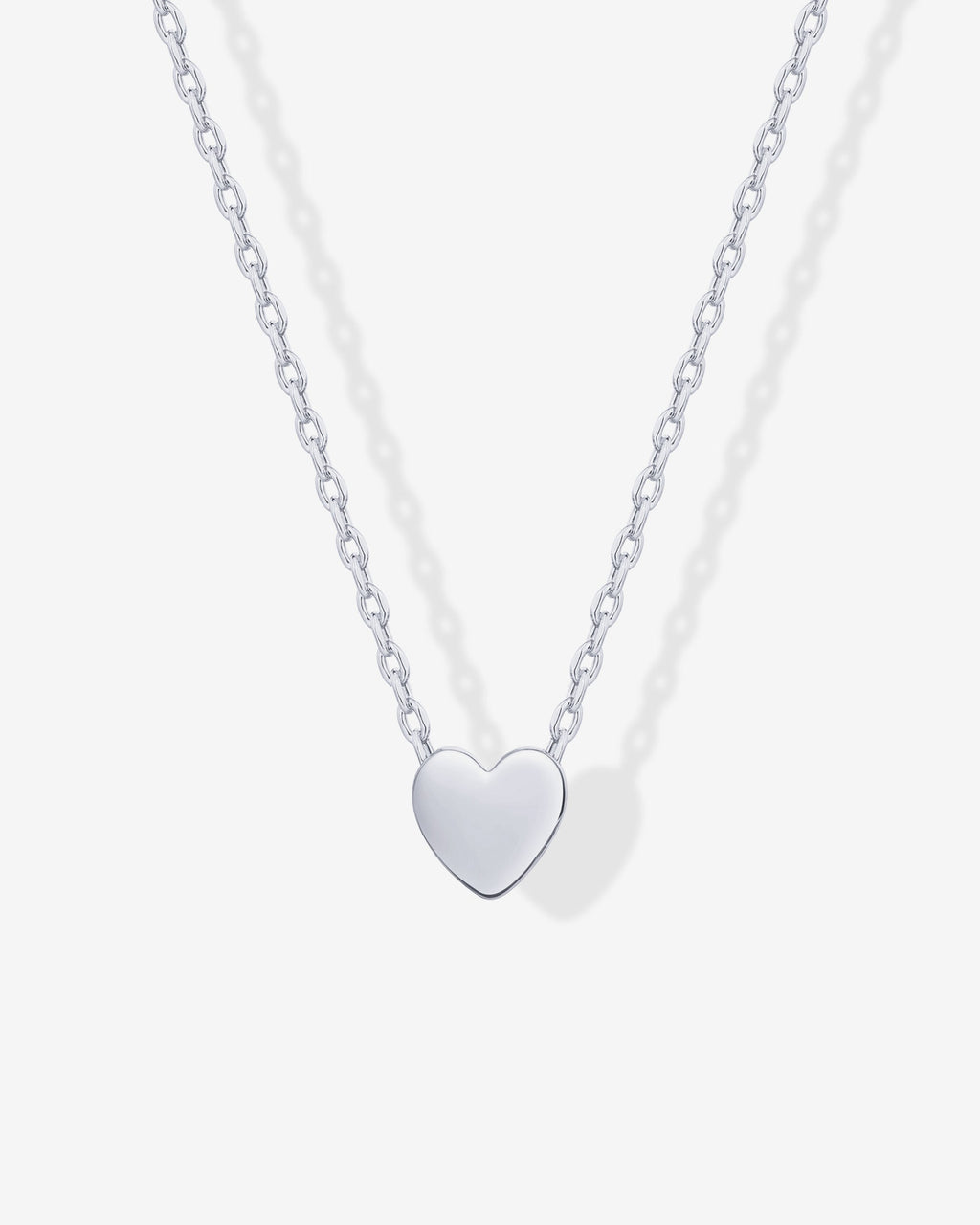Close-up of a silver-tone heart pendant on a fine chain (PAVOI reference image; supplier appearance awaits verification)