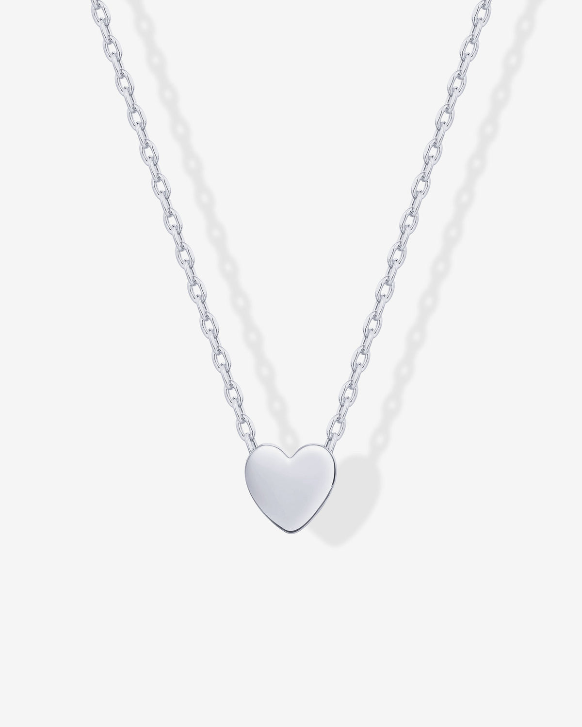 Close-up of a silver-tone heart pendant on a fine chain (PAVOI reference image; supplier appearance awaits verification)
