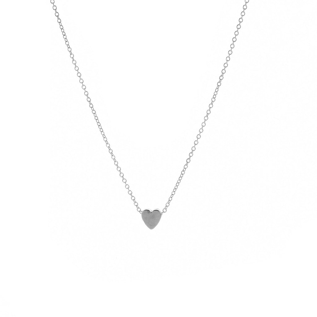 Silver-tone smooth heart pendant necklace on a white background