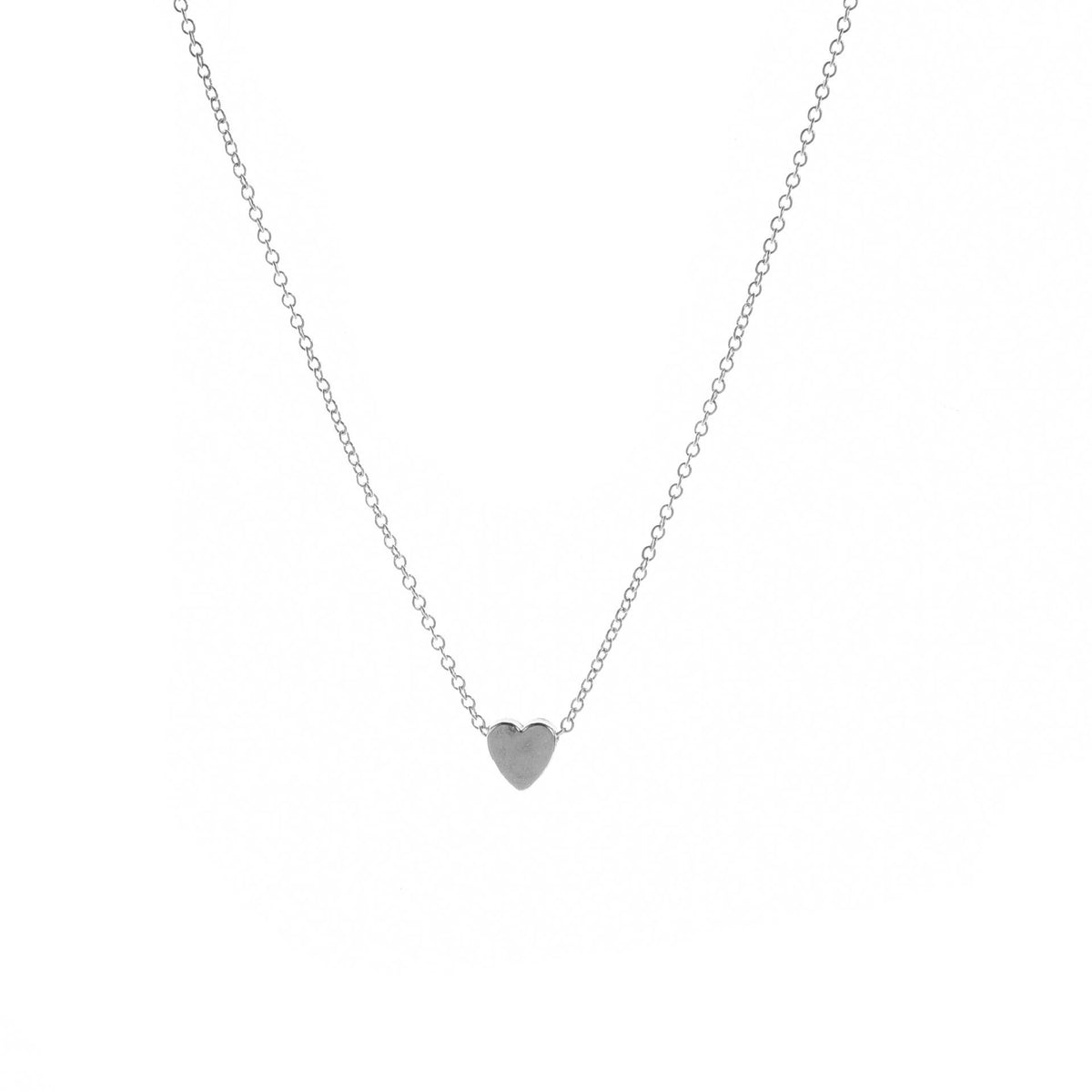 Silver-tone smooth heart pendant necklace on a white background